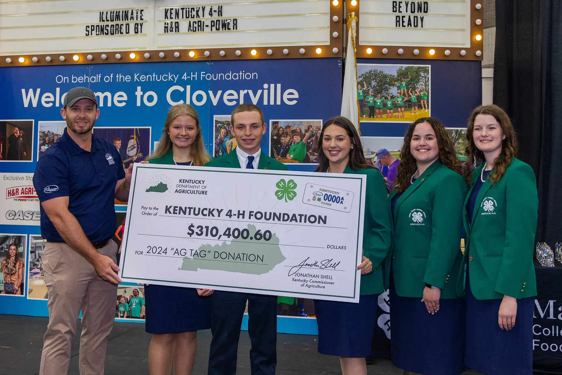 people posing with huge check | Kentucky 4-H Youth Advocacy Program