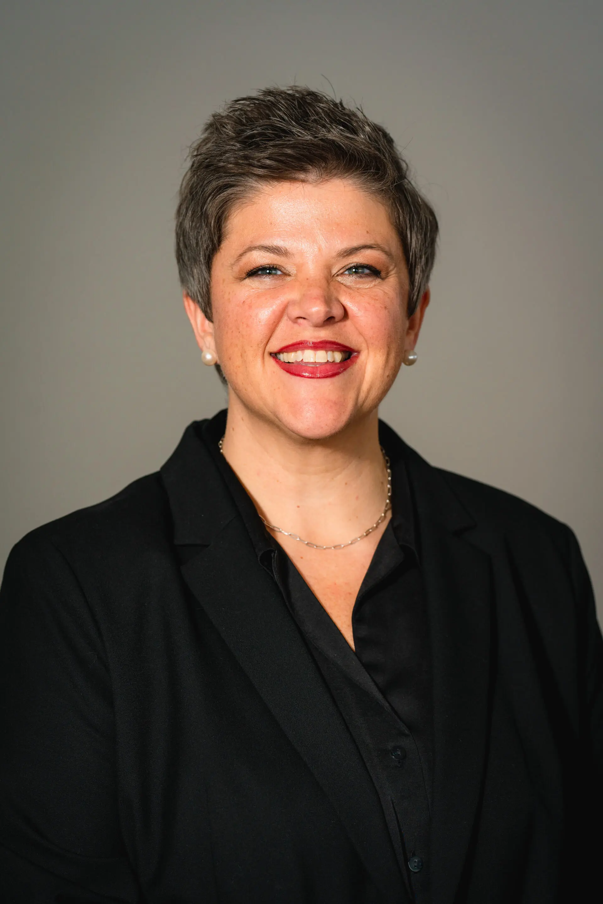 woman with short hair and grey background